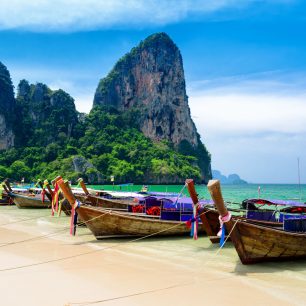 18379843 - traditional thai boats at the beach of krabi province.