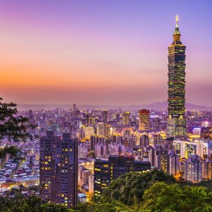 24480560 - modern office buildings in taipei, taiwan at dusk.