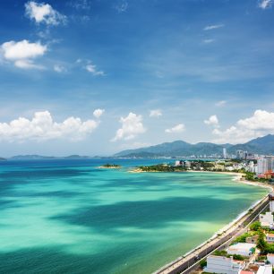 40555122 - beautiful view on nha trang and nha trang bay of the south china sea with magic colors of water on blue sky background in khanh hoa province, vietnam. nha trang is a popular tourist destination of asia.